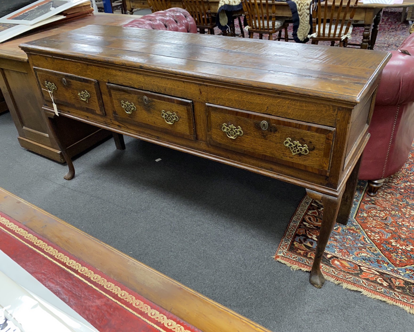 An 18th century banded oak cabriole leg low dresser, length 176cm, depth 51cm, height 90cm